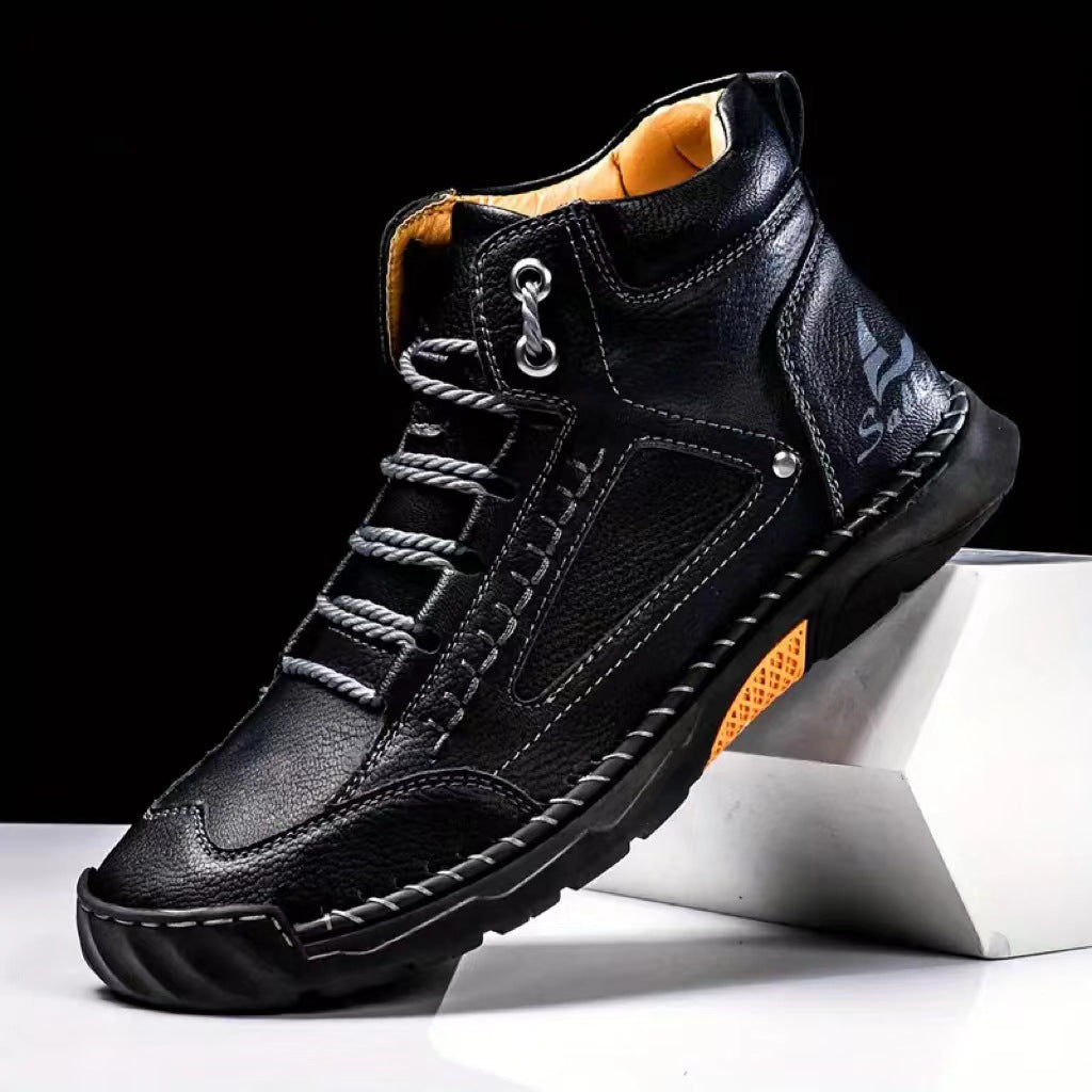Black leather hiking boot with orange accents and rugged sole