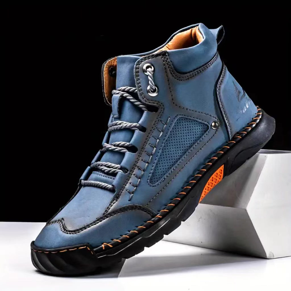 Blue high-top hiking boots with orange stitching and rugged sole design